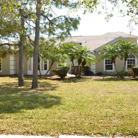 Buy this 4 bed house on 1728 Winding Ridge Circle in Palm Bay, FL 32909