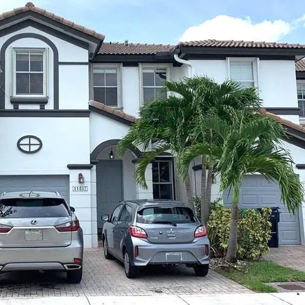 Rent this 4 bed townhouse on 11487 Northwest 77th Street in Medley, Doral