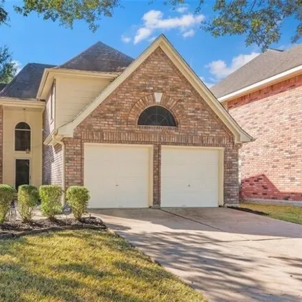 Buy this 4 bed house on 16819 Scenic Gardens Drive in Champion Forest, TX 77379