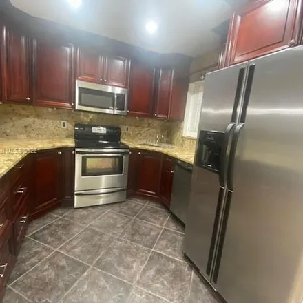 Rent this 2 bed apartment on Cocoplum Circle in Coconut Creek, FL