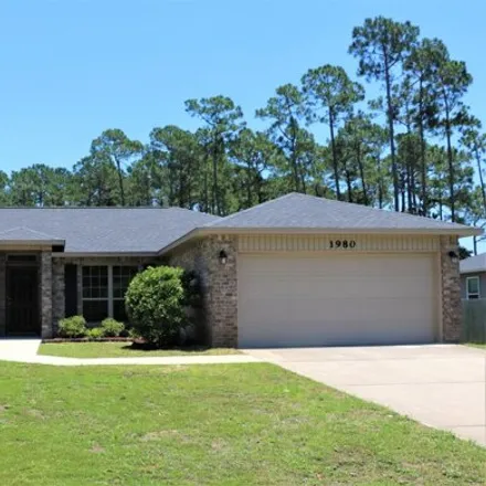 Rent this 4 bed house on 1980 Salamanca St in Navarre, Florida