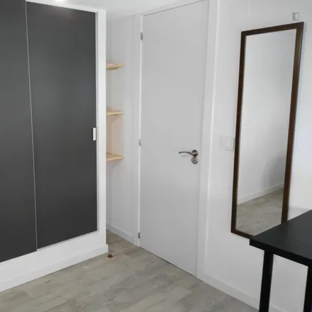 Rent this 6 bed room on Calle Ángela González in 14, 28038 Madrid
