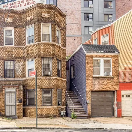Buy this 4 bed townhouse on 1897 Longfellow Avenue in New York, NY 10460