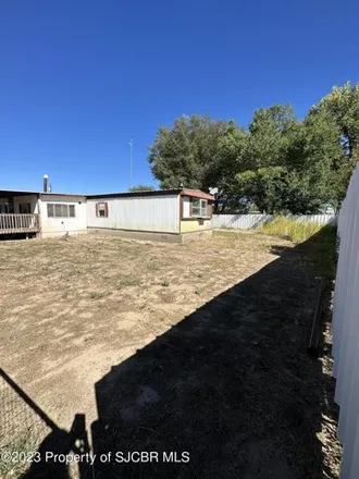 Buy this studio apartment on 672 Huntington Circle in Bloomfield, NM 87413