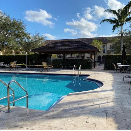 Rent this 4 bed apartment on 3189 North 102nd Path in Vanderbilt Park, Doral