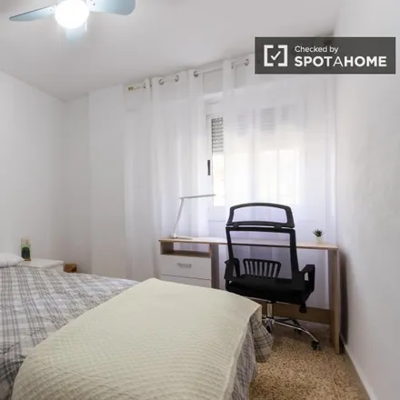 Rent this 4 bed room on Calle de Santísima Trinidad in 46100 Burjassot, Spain