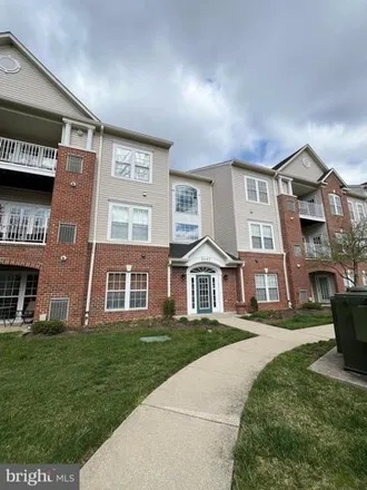 Rent this 2 bed condo on Amber Orchard Court East in Piney Orchard, MD 21113