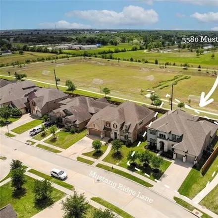 Buy this 4 bed house on 3579 Mustang Ridge Lane in Pearland, TX 77584