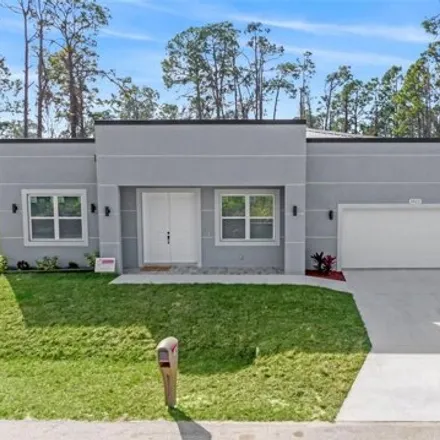 Buy this 3 bed house on 1623 Kadashow Ave in North Port, Florida
