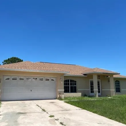 Rent this 3 bed house on 617 Dauphine Avenue South in Lehigh Acres, FL 33974