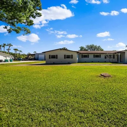 Buy this 4 bed house on 2563 Lakecrest Boulevard in West Melbourne, FL 32934