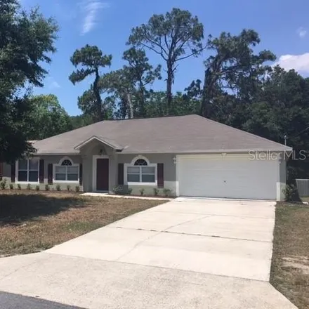 Rent this 4 bed house on 11233 Topaz Street in Spring Hill, FL 34608