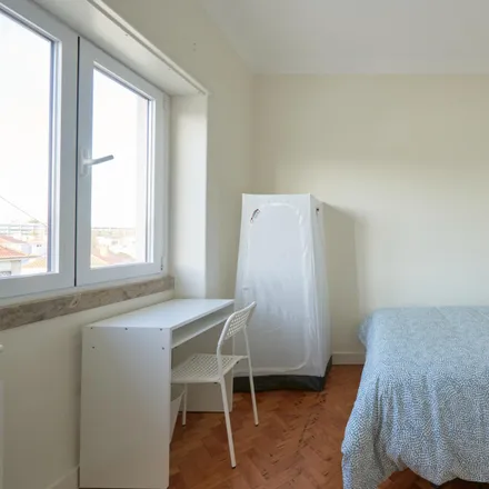 Rent this 14 bed room on Rua Carlos Malheiro Dias 11 in 1700-108 Lisbon, Portugal