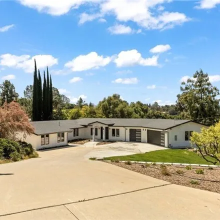 Rent this 4 bed house on 1908 Country Club Drive in Redlands, CA 92373