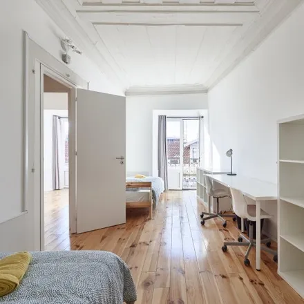 Rent this 8 bed room on Rua Dom Luís I in 1200-225 Lisbon, Portugal