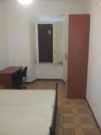 Rent this 4 bed room on Farmacia Merulana in Via Merulana, 185