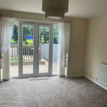Rent this 3 bed townhouse on Newhall Park Drive in Bradford, BD5 8FA
