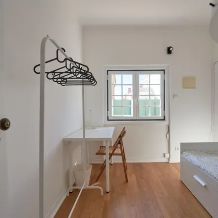 Rent this 5 bed room on Rua 30 in 1300-663 Lisbon, Portugal