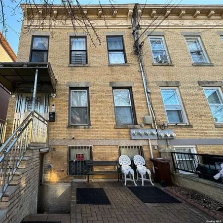 Buy this 9 bed house on 66-34 74th Street in New York, NY 11379