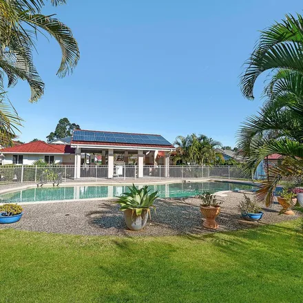 Rent this 3 bed apartment on Swanton Dr near Springsure Dr in Swanton Drive, Mudgeeraba QLD 4230