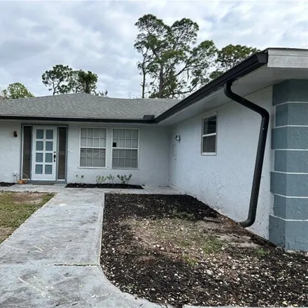 Buy this 4 bed house on 214 5th Ave in Lehigh Acres, Florida