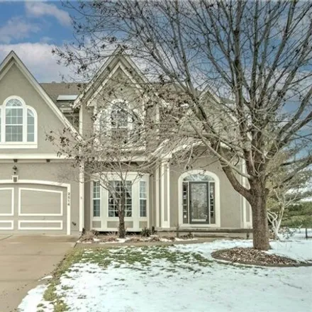 Buy this 4 bed house on 2548 Northeast Lake Breeze Drive in Lee's Summit, MO 64086
