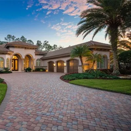 Buy this 4 bed house on 2611 Hawks Landing Blvd in Palm Harbor, Florida