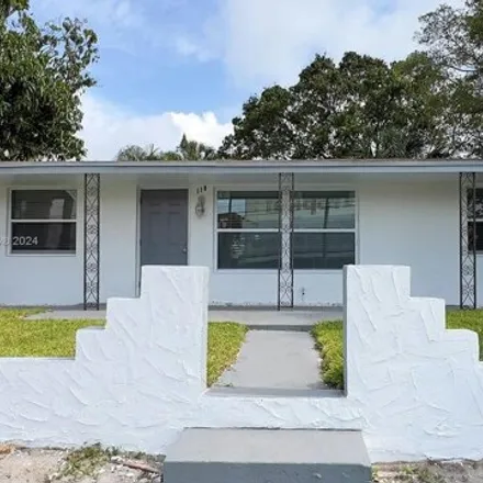 Rent this 3 bed house on 118 W 10th St Unit 1 in Riviera Beach, Florida