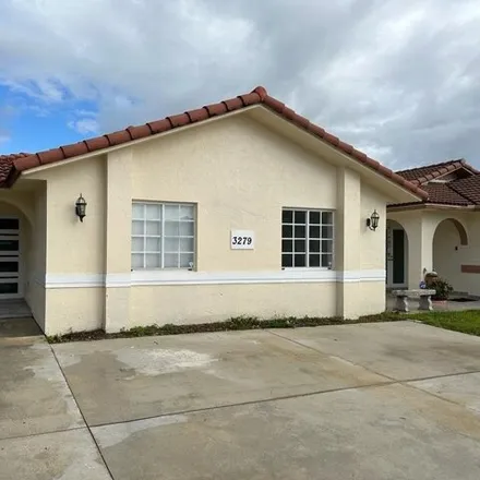 Rent this 3 bed house on 3279 West 77th Place in Hialeah, FL 33018