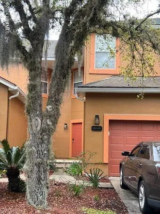 Rent this 3 bed townhouse on 6855 Lake Mist Lane in Sweetwater, Jacksonville