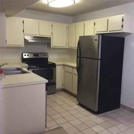 Rent this 2 bed condo on 400 Palm Cir W Apt 201 in Pembroke Pines, Florida