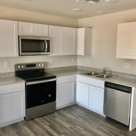 Rent this 4 bed apartment on 13534 West Camelia Drive in Arizona City, Pinal County