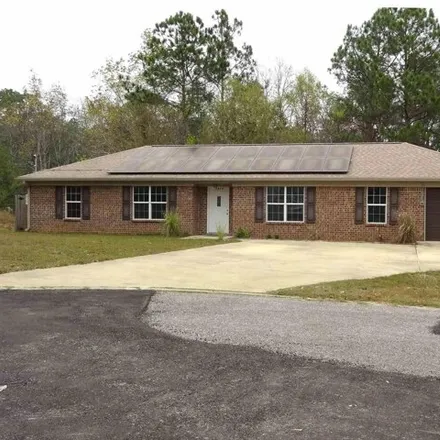 Buy this 4 bed house on 1898 Winding Creek Circle in Escambia County, FL 32533