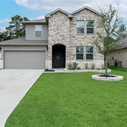 Rent this 4 bed house on Strong Horse Drive in Conroe, TX 77301