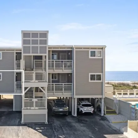 Buy this 2 bed condo on Oak Island Golf Club in 928 Caswell Beach Road, Caswell Beach