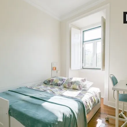 Rent this 4 bed room on Rua 16 in 1350-297 Lisbon, Portugal