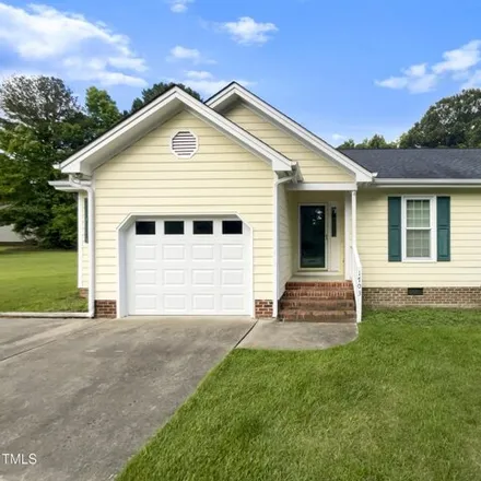 Buy this 3 bed house on 1703 Farm Lake Dr in Holly Springs, North Carolina