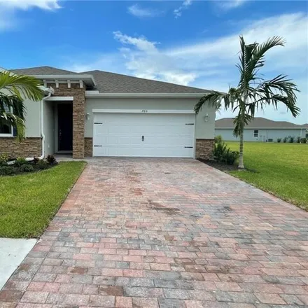 Rent this 3 bed house on 703 Heather Lake Ave in Cape Coral, Florida