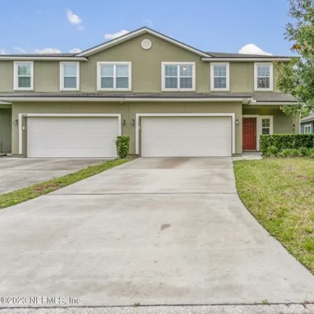 Buy this 3 bed townhouse on Caney Oaks Drive in Jacksonville, FL 32226