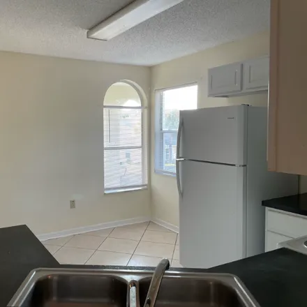Rent this 3 bed condo on 3211 B Sabal palms ct