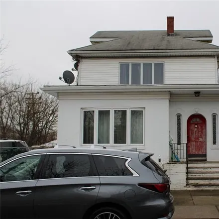 Buy this 4 bed house on 90 Erastina Place in New York, NY 10303