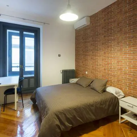 Rent this 14 bed apartment on Madrid in Librería Letras, Calle de Hortaleza