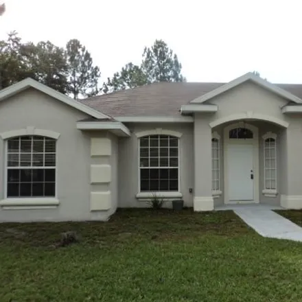 Rent this 4 bed house on 14 Radium Lane in Palm Coast, FL 32164