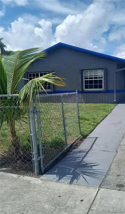 Rent this 4 bed house on 2691 Northwest 8th Street in Collier Park, Pompano Beach