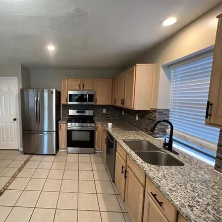 Rent this 4 bed house on 4986 Hickorygate Drive in Harris County, TX 77373