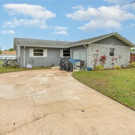 Buy this 4 bed house on 6767 Yucatan Drive in Winter Park, FL 32807
