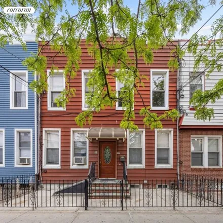 Buy this 4 bed townhouse on 62-08 68th Avenue in New York, NY 11385