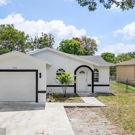 Buy this 4 bed house on 1632 Northwest 7th Lane in Sanders Park, Pompano Beach