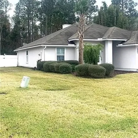 Rent this 4 bed house on 23687 Flora Parke Boulevard in Yulee, FL 32034