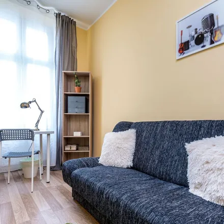 Rent this 5 bed apartment on Święty Marcin 76 in 61-809 Poznań, Poland